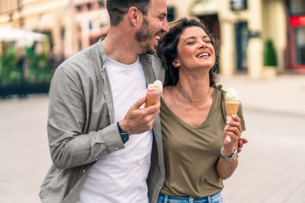 couple enjoying ice cream on a walk